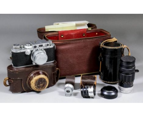 A 1930's Leica III camera, body No, 347337, with 5cm lens, view finder, petri meter, Soligor telephoto, lens 1'4, F105mm, No.