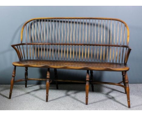 An ash and elm seated stick back Windsor settee, with two-tier back, on turned legs and stretcher, 62ins wide x 42ins high