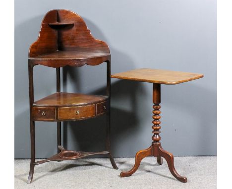 A George III mahogany corner wash stand, one real and two dummy drawers, on square splayed legs, 26ins wide x 16ins deep x 43