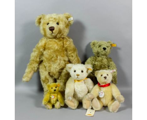 A late 20th Century Steiff plush mohair teddy bear with hump and button eyes, 18ins, and four other Steiff bears, various