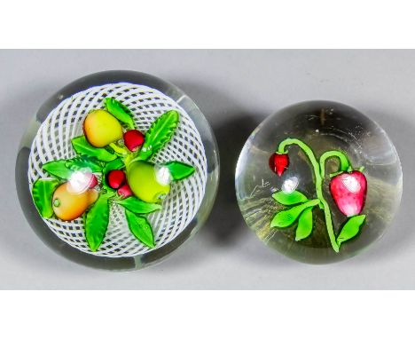 A St Louis fruit paperweight on a white latticino ground, 3.25ins diameter x 2.5ins high, and a clear glass paperweight set w