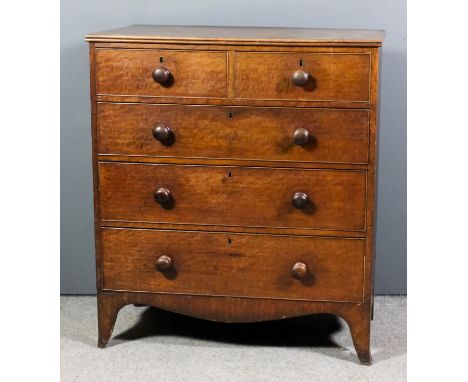 A late Georgian mahogany chest with twin reeded edge to top, fitted two short and three long drawers, on shaped apron and bra