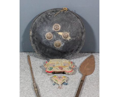 A late 19th/early 20th Century South African steel spear with wooden shaft, 87ins, (tip missing), another, 50.5ins, and a Chi