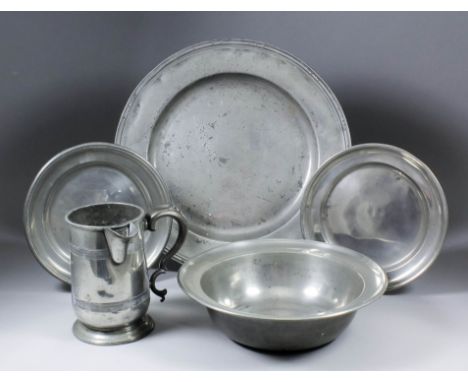 A small collection of Continental and English pewter, including - an early 19th Century 9.25ins diameter shallow dish with tr