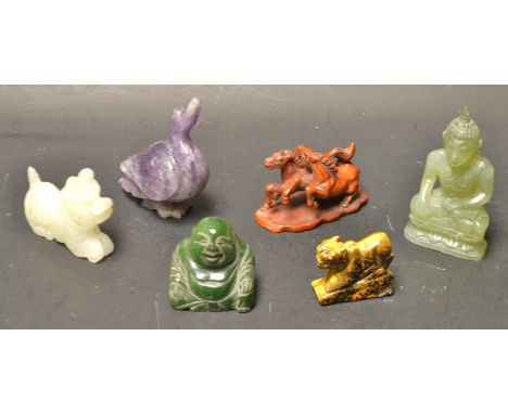 A jade Buddha; another; a hardstone goose; tiger; Dog of Fo; a wooden netsuke, as two horses
