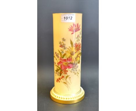 A Royal Worcester cylindrical vase, printed and painted with colourful spring flowers, on a blush ivory ground, the base with