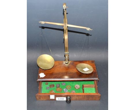 A set of brass precision balance scales. 