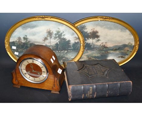 An oak mantel clock; a Victorian brass mounted family Bible; a pair of framed oval landscape prints (4)