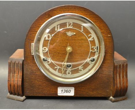 An early 20th century oak mantel clock, Westminster chime, key