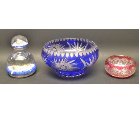 A late 19th century millefiori mallet shaped inkwell and cover, faults; a Bohemian blue flashed bowl; another, smaller, in re