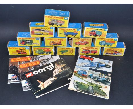 A Dinky toys no.8 catalogue, 1971 first edition; a Corgi 1979 catalogue, another similar; Matchbox presentation boxes