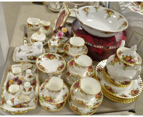 A Royal Albert Old country roses dinner and tea service for six; others similar, a large wash bowl,boxed; a photograph frame;
