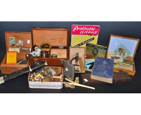 A miniature microscope; a collar stud box; a set of Wade Whimsie dinosaurs; a pewter hipflask; souvenir postcards; a cribbage