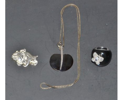 A silver pendant, as a bulldog; a silver and enamel ring; a silver mounted pendant on a neckchain