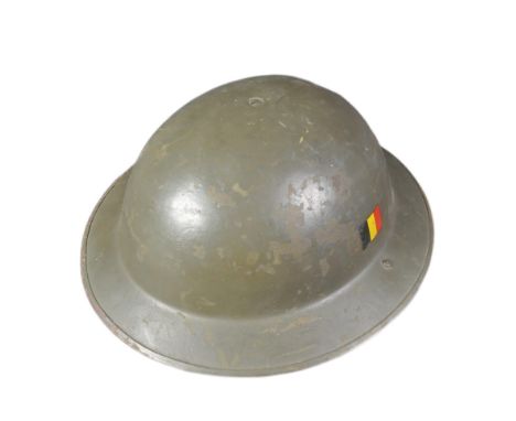 A vintage 1950s (1958) Belgian MKII / Mark 2 helmet. The helmet being a clone of the British Brodie helmet with a Belgian fla