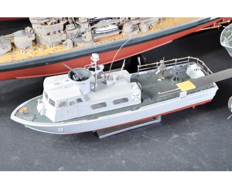 A collection of assorted scratch built hand made model warship boats comprising; Queen Elizabeth Class HMS Warspite, King Geo