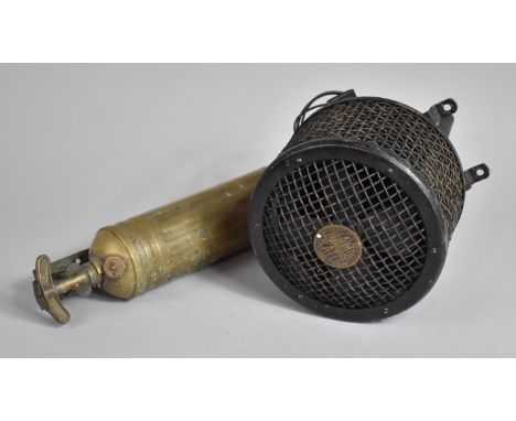A Vintage Brass Fire Extinguisher with Bracket Together with a Vintage Clayton Fan Heater 