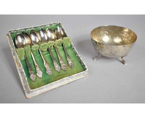 A Circular Silver Bowl on Three Hoof Feet, Repousse Floral Decoration Together with a Cased Set of Siam Sterling Silver Coffe