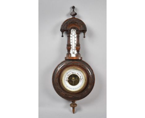 A Late Victorian Walnut Framed Aneroid Wheel Barometer with Thermometer, 46cm high 