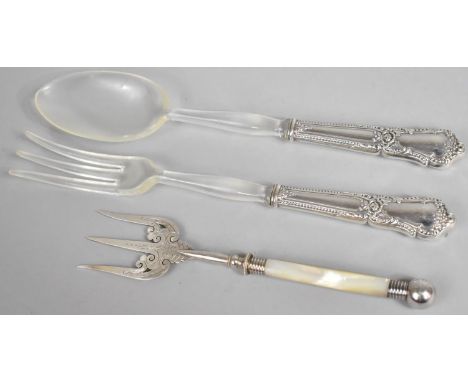 A Pair of Silver Handled Salad Servers and a Mother of Pearl Handled Bread Fork 