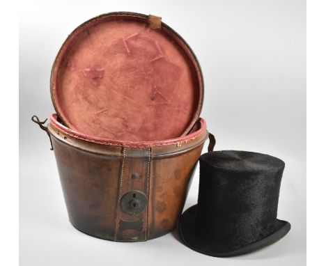 A Late 19th/Early 20th Century Top Hat Box, Hinge to Lid Requires Refixing Containing a Distressed Brushed Top Hat and Having