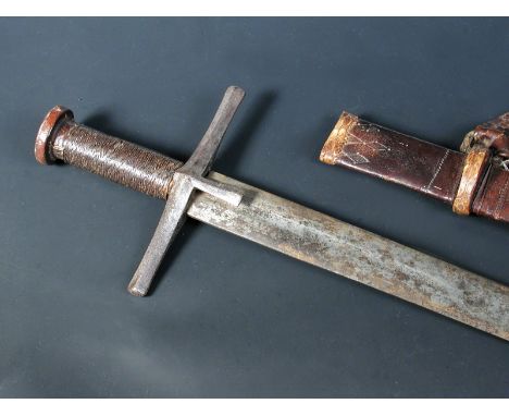 A late 19th century Sudanese Kaskara, complete with leather scabbard suspension loops and straps  