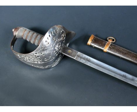 A Victorian cavalry officers sword, the pierced hilt with 'VR' cipher, the blade with etched decoration, within a painted sca