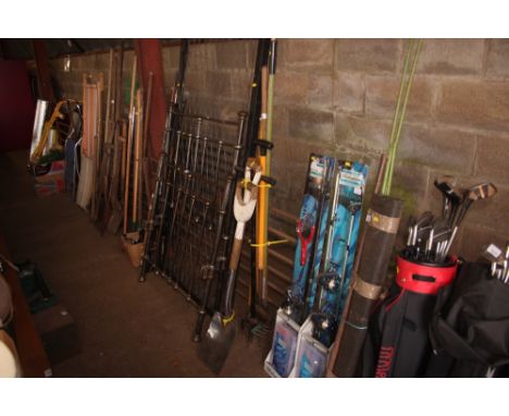 A bundle of long handled gardening tools 