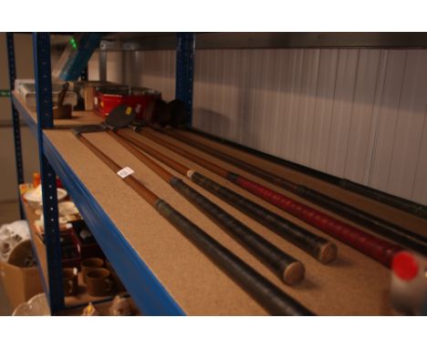 A quantity of vintage golf clubs
