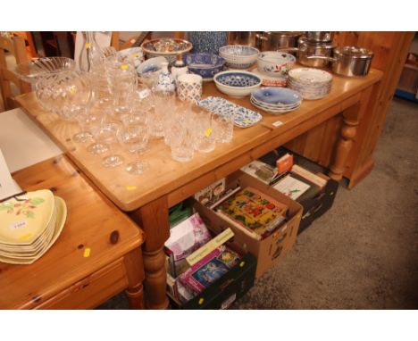 A stripped pine kitchen table, together with a set of four ladder back dining chairs