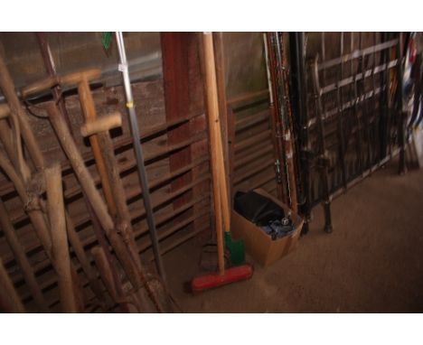 A quantity of long handled gardening tools 