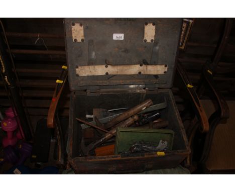 A small metal bound tool chest and contents 