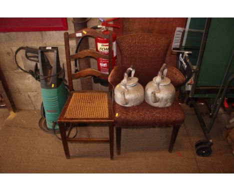 A small armchair, together with a ladder back cane seated chair