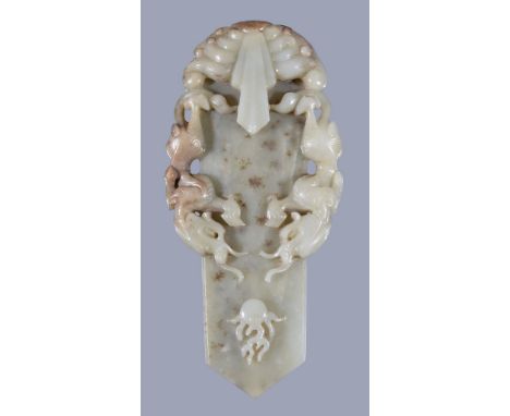  A Chinese celadon jade ceremonial tablet,   carved in the form of  Gui   rising from waves and each side carved with facing 