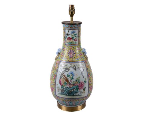  A Chinese yellow-ground vase  , late Qing Dynasty, of slender baluster form, painted with panels of birds and flowers, 'mask