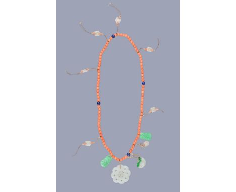 Ω A Chinese coral, lapis lazuli and jade necklace, comprising ninety-eight coral beads, four large lapis beads, the necklace 