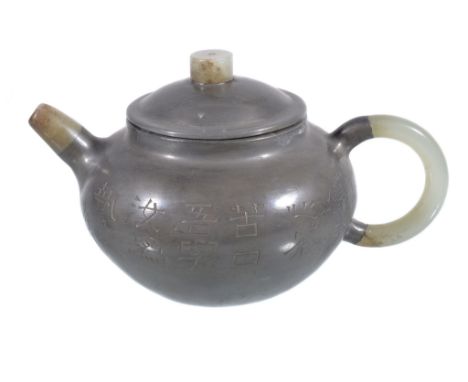  A Chinese pewter mounted Yixing teapot and cover,   the ovoid body     incised on one side with Chinese script signed by the