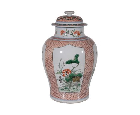  A Chinese  Famille Verte   vase and cover  , in Transitional style, painted with flowering peony, prunus and chrysanthemum o