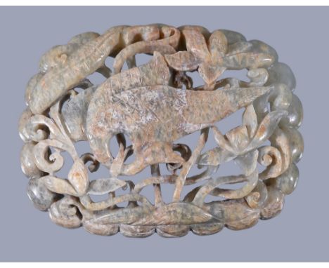  A Chinese celadon and russet jade 'bird' plaque  , carved and pierced with a crane amidst lotus flowers and leaves, all with