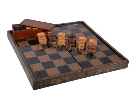  A Chinese export lacquered hinged games board  , Qing Dynasty, late 19th century, the box decorated with trees, figures and 