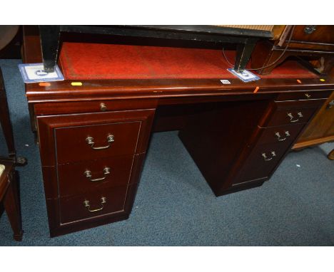 A REPRODUCTION MAHOGANY RED LEATHER TOPPED DESK with six drawers, together with a Bradley mahogany sofa table with two drawer