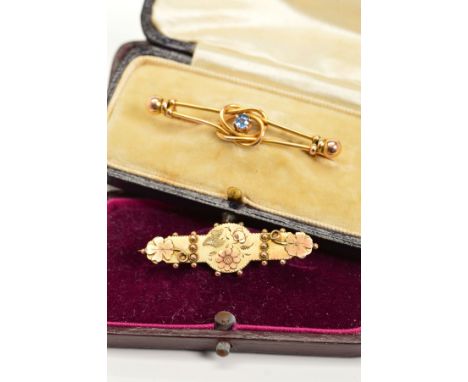 TWO EARLY 20TH CENTURY 9CT GOLD BROOCHES, the first designed with a central circular blue sapphire within a wirework knot sur