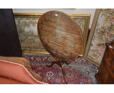 A GEORGIAN OAK CIRCULAR TOPPED TRIPOD TABLE (The content of this lot comes from The Abbots Bromley School)