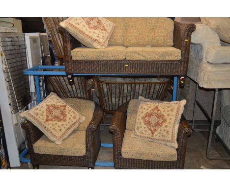 A DARK WICKER CONSERVATORY THREE PIECE SUITE comprising of a two seater settee and two armchairs, with removable cushions (3)