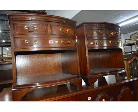 A PAIR OF MODERN MAHOGANY BOW FRONT BEDSIDE CHESTS with a brushing slide, two short and one long drawers over one shelf with 