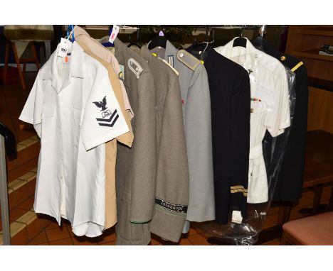 NINE VARIOUS UNIFORMS to include three US forces uniform as follows (a) Sand coloured short sleeve shirt, US Army patch and s