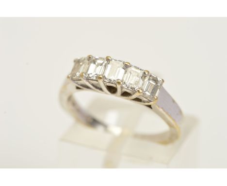 AN 18CT WHITE GOLD DIAMOND RING, set with five emerald cut diamonds within shared four claw settings to the plain polished ba