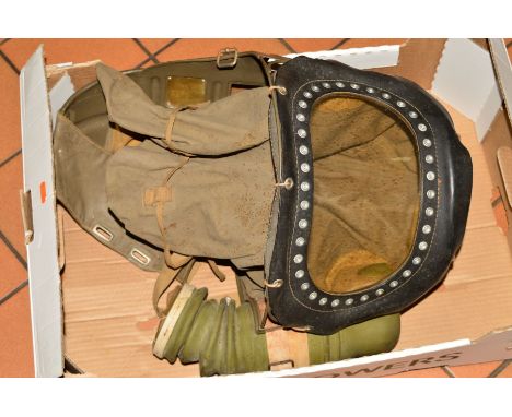 A 1939 BRITISH ISSUE GAS MASK FOR BABIES AND TODDLERS UP TO 2 YEARS OF AGE, first issued in 1938, this mask was big enough to