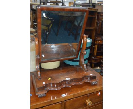 A GEORGIAN MAHOGANY SWING MIRROR with serpentine front to base, width 60cm x depth 29cm x height 67cm, a modern shield shaped