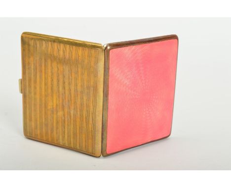 A GOLD PLATED AND PINK ENAMEL CIGARETTE CASE, engine turned decoration back and front, gilt interior, lacks elastic strap